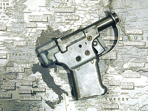 The FP-45 Liberator pistol laying on top of a map of Europe