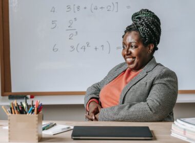 cheerful solid black woman expecting for lesson