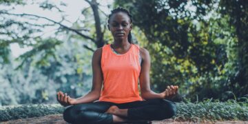 woman meditating in the outdoors