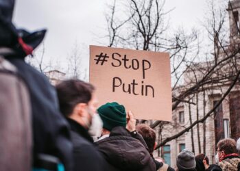 people in the street protesting against war
