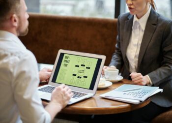 man and woman in a meeting