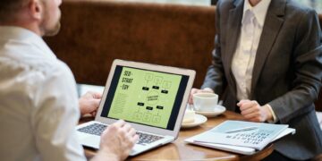 man and woman in a meeting