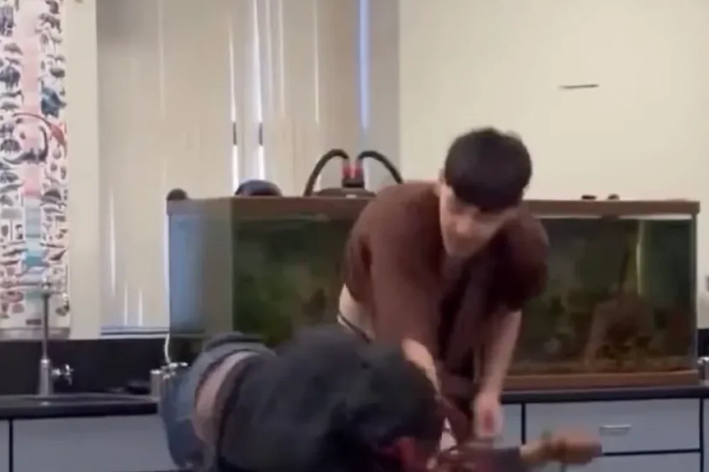 A video screenshot shows a boy and girl in a physical altercation. (Photo: X/@Chris490360)