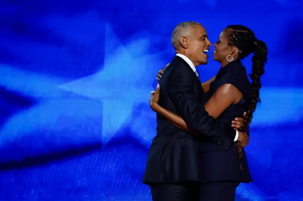 Former U.S. President Barack Obama (L) greets former first lady Michelle Obama as he arrives to speak on stage during the second day of the Democratic National Convention at the United Center on August 20, 2024 in Chicago, Illinois. Photo: Chip Somodevilla (Getty Images)