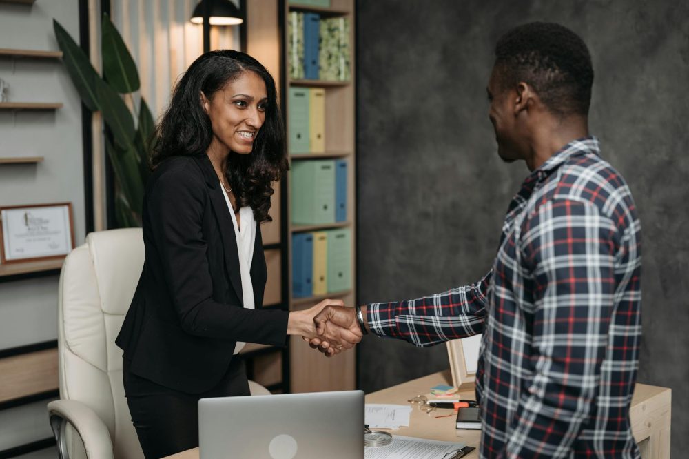 female lawyer and client doing a handshake