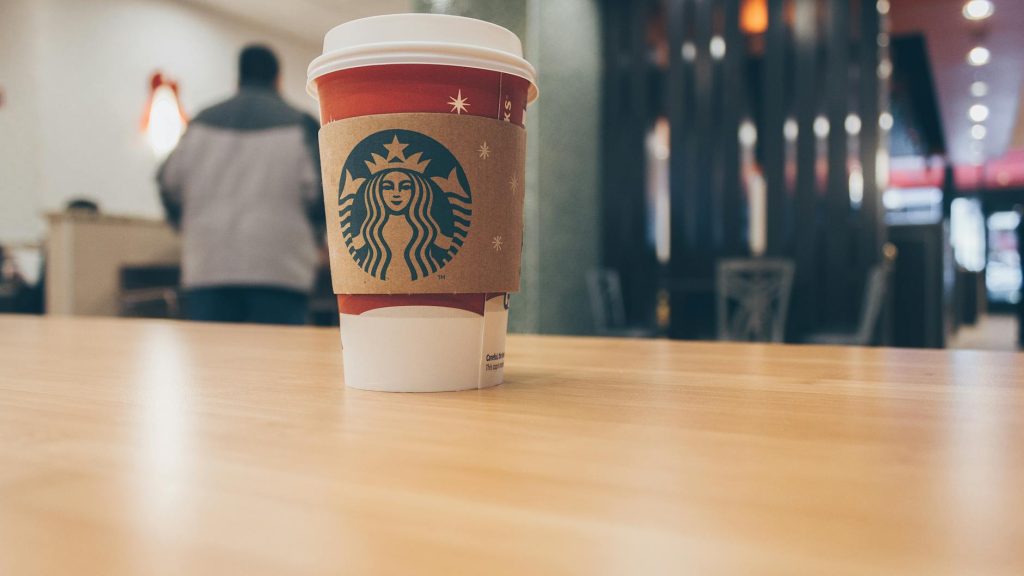 photo of paper cup on top of the table